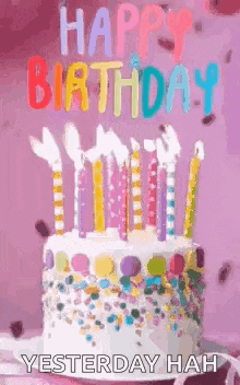 a birthday cake with candles and sprinkles on it and the words `` happy birthday yesterday hah '' .