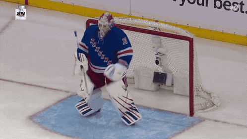 a goalie for the new york rangers jumps in the air