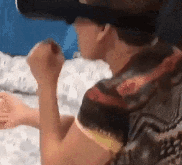 a person wearing a virtual reality headset is playing a game