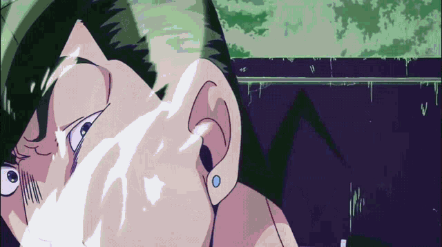 a close up of a person 's face with a green hair