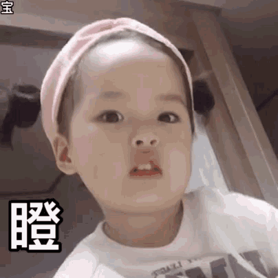 a baby girl wearing a pink headband and a white shirt is making a funny face .