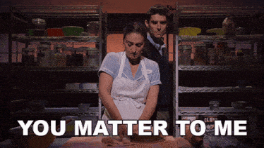 a man and woman in a kitchen with the words you matter to me