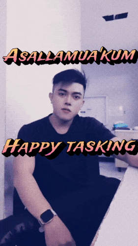 a man sitting in front of a wall with the words assalamuakum happy tasking above him