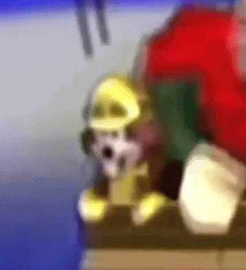 a blurred image of a stuffed animal with a yellow hat