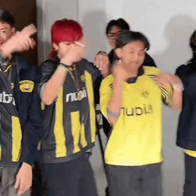 a boy with red hair is smoking a cigarette while wearing a nubi jersey