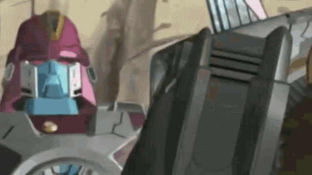 a close up of a robot with a pink head and a blue head .