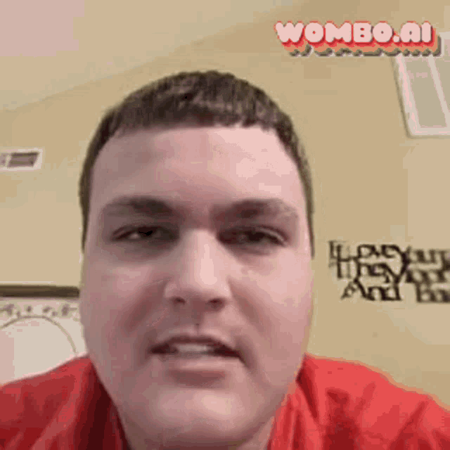 a man in a red shirt is looking at the camera with a wombo.ai logo in the corner