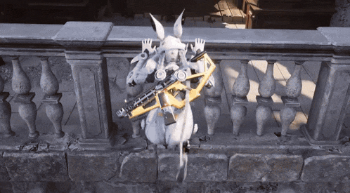 a statue of a rabbit holding a gun standing on a railing