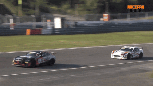 a white race car with the number 15 on it