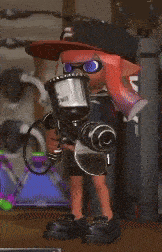 a squid wearing a hat and sunglasses is holding a cup