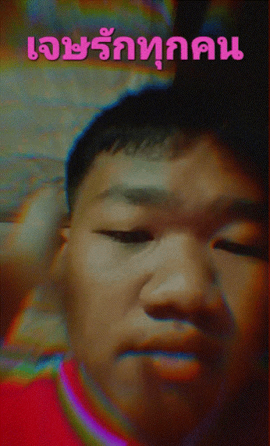 a man 's face is shown in a blurry photo with the words ' เจ้า รัก ทุก คน ' written above him