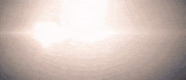 the sun is shining brightly in the sky with a gray background