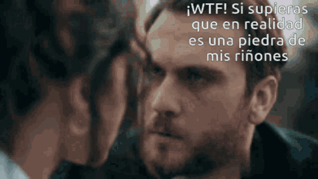 a man and a woman are looking into each other 's eyes with a caption that says wtf