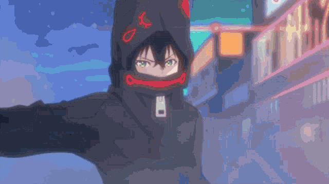 a person wearing a black hoodie with a red star on it