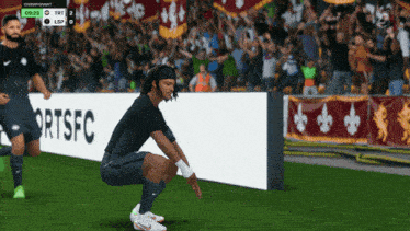 a soccer player squats in front of a banner that says fort fc