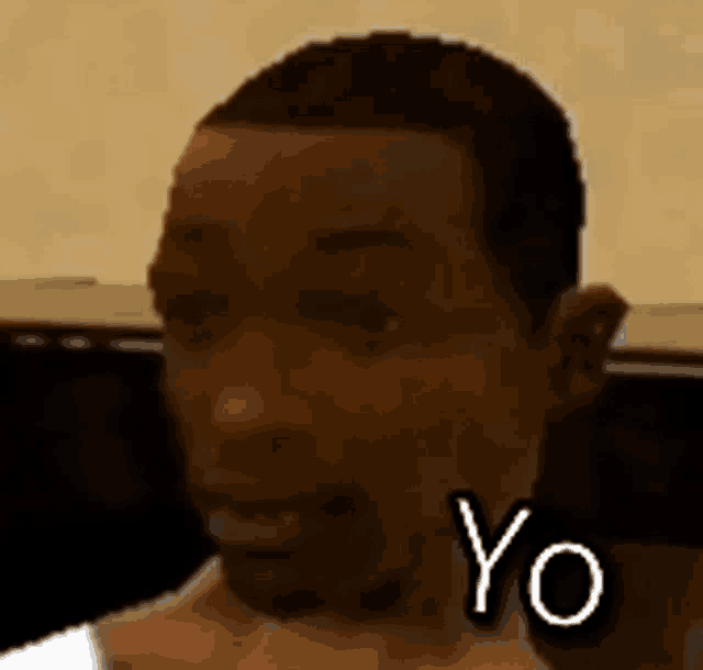 a close up of a man 's face with the words yo on it .