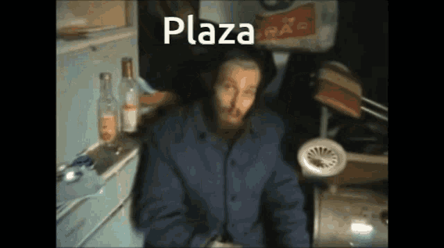 a blurry picture of a man with the word plaza written above him