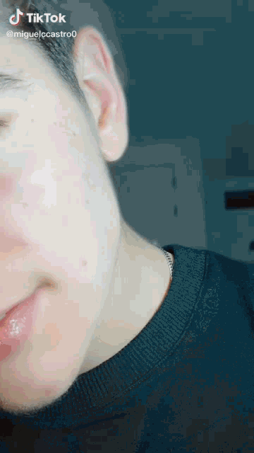 a close up of a man 's face with a tik tok watermark