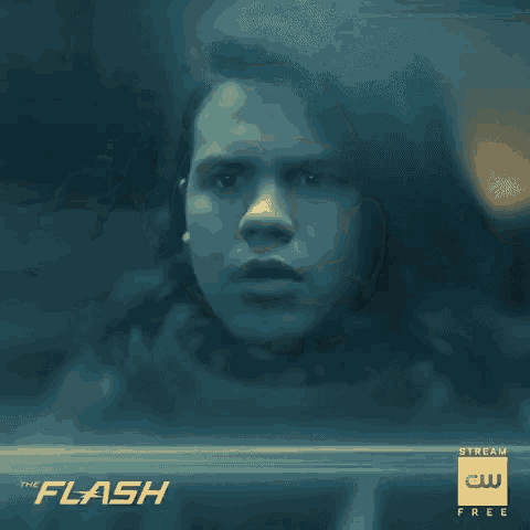 a poster for the flash shows a man in a black suit