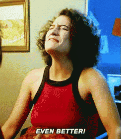 a woman in a red tank top is crying and says even better !