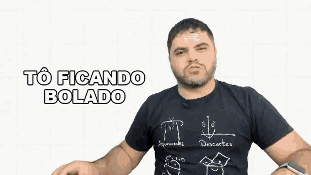 a man with a beard is wearing a black shirt that says descortes