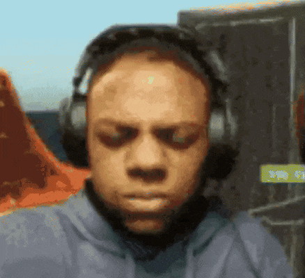 a man wearing headphones and sunglasses is making a funny face