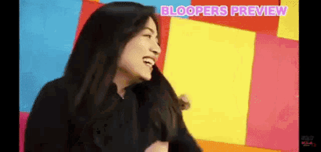 a woman is laughing in front of a colorful background and the words bloopers preview are visible