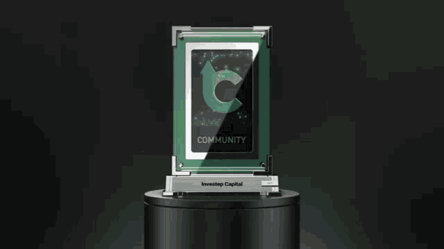 a trophy that says community is on a black pedestal