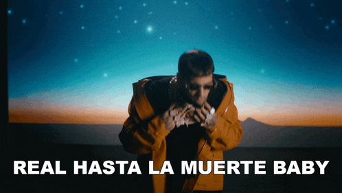 a man in a yellow jacket with the words real hasta la muerte baby