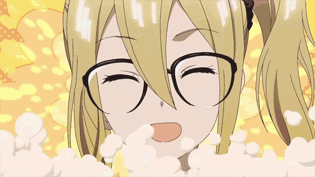 a girl with blonde hair and glasses is smiling in a yellow background