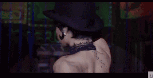 a close up of a woman wearing a hat