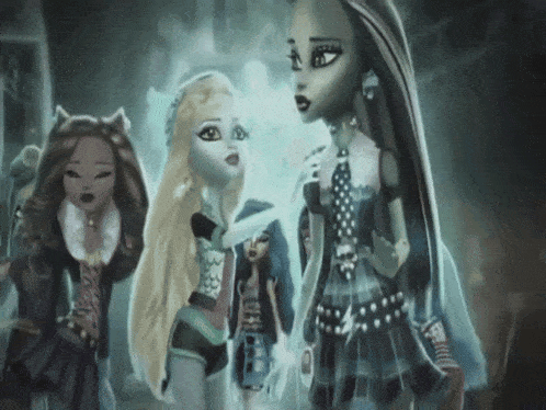 three monster high dolls standing next to each other