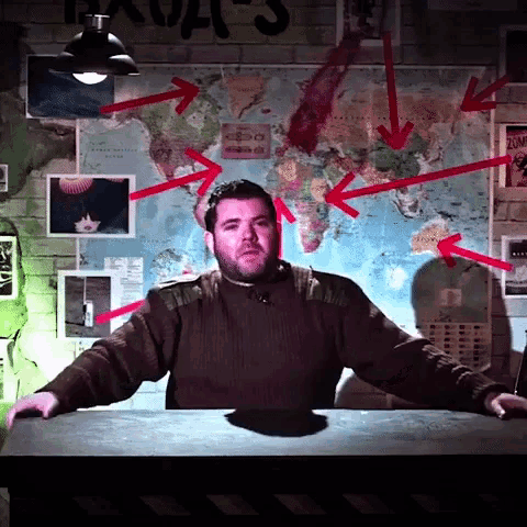 a man stands in front of a map with red arrows pointing to various places