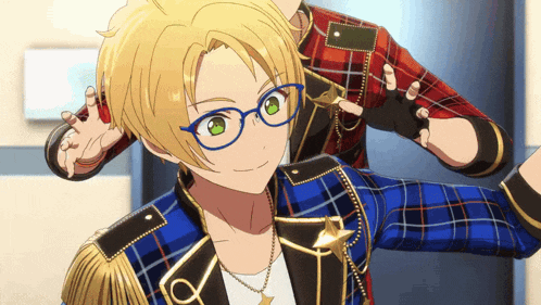 a boy wearing glasses and a plaid shirt has the letter a on his chest