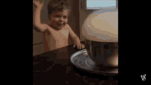 a little boy is standing in a bathtub surrounded by smoke and a bowl of milk .