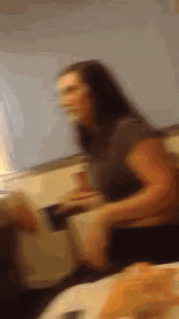 a blurry picture of a woman in a kitchen