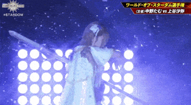 a woman in a white dress is holding a sword in front of a purple background that says stardom