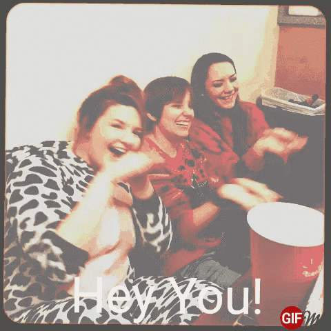 a gif of three women laughing with the words hey you on the bottom