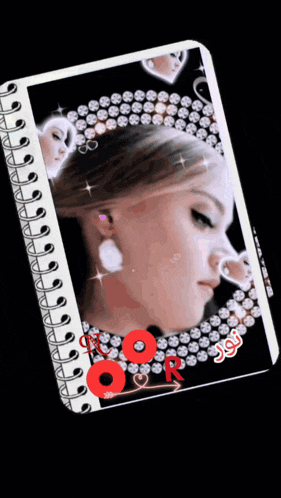 a spiral notebook with a picture of a woman with a crown on her head