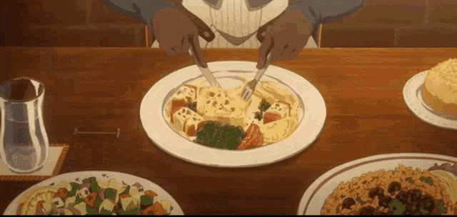 a person is cutting a plate of food with a fork and knife