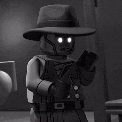 a lego man with glowing eyes and a hat