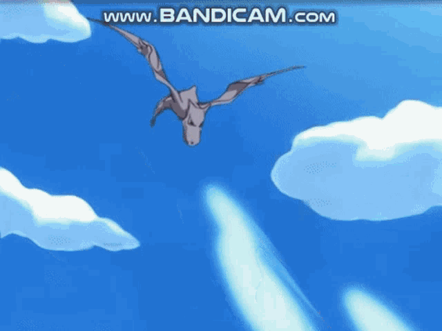 a cartoon character is flying through a blue sky with the words www.bandicam.com on the bottom right