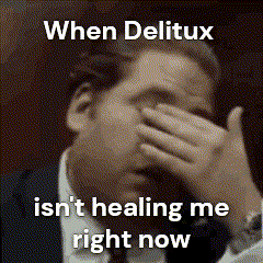 a man in a suit is covering his face with his hand and the words when delicux isn 't healing me