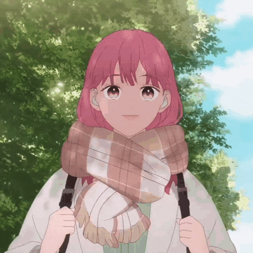 a girl with pink hair wearing a plaid scarf