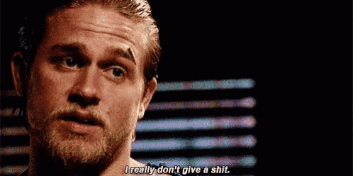 a man with a beard is saying `` i really don 't give a shit . ''