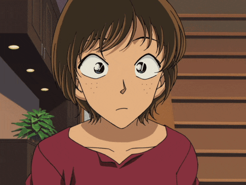 a close up of a girl 's face with a serious look on her face