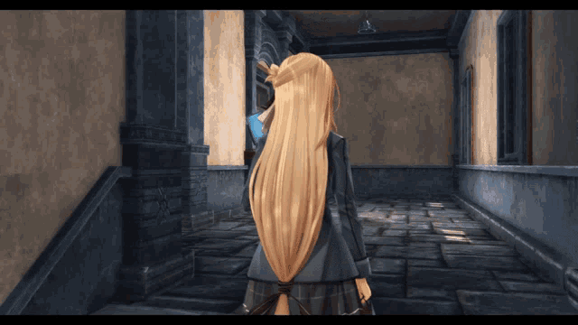 a woman with long blonde hair is standing in a hallway