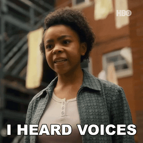 a woman says " i heard voices " in front of a brick building