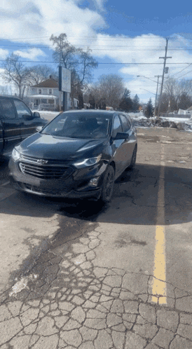 a chevrolet car is parked in a parking lot
