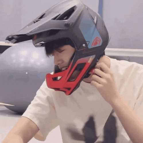 a man wearing a helmet that says ' fox racing ' on it